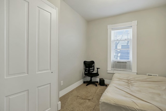 bedroom featuring light carpet