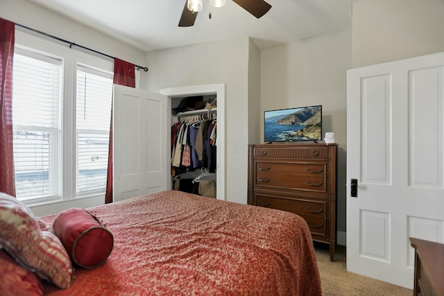 carpeted bedroom with a closet and ceiling fan