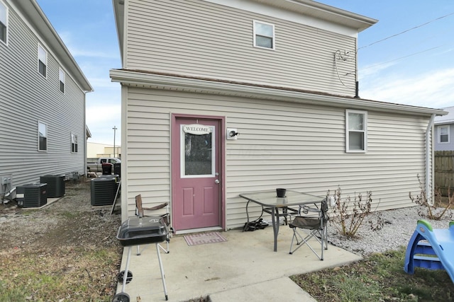 rear view of house with central air condition unit