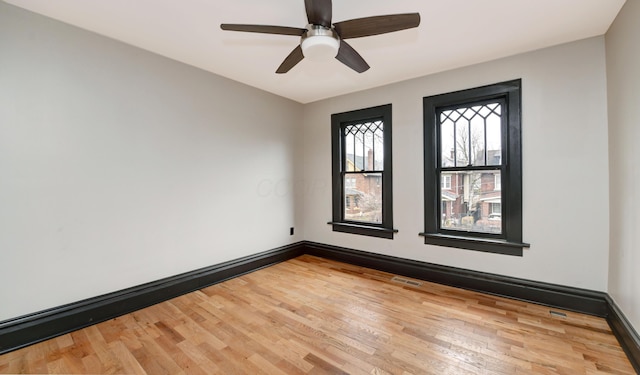 unfurnished room featuring wood-type flooring and ceiling fan