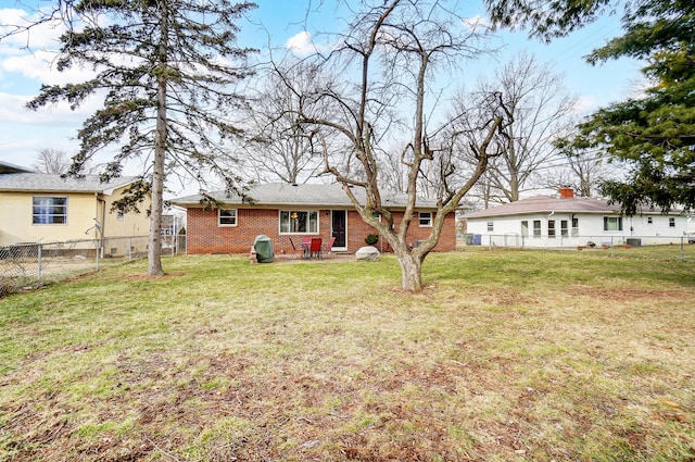 back of house featuring a yard