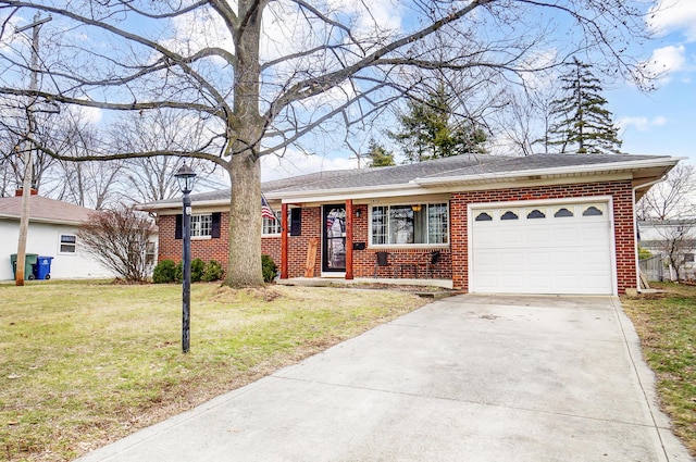 ranch-style home with a garage and a front lawn