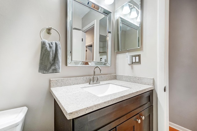 bathroom with vanity and toilet