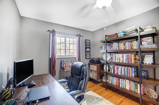 office area with hardwood / wood-style floors and ceiling fan