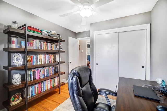 home office featuring hardwood / wood-style flooring and ceiling fan