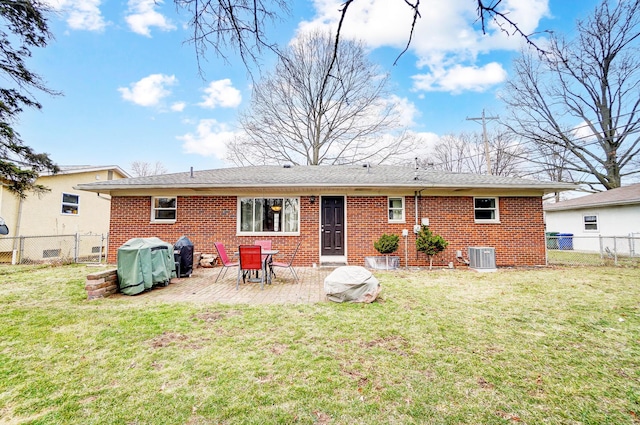 rear view of house with a patio, central AC unit, and a lawn