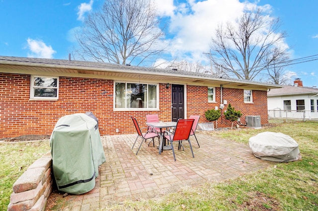 back of property featuring central AC and a patio area