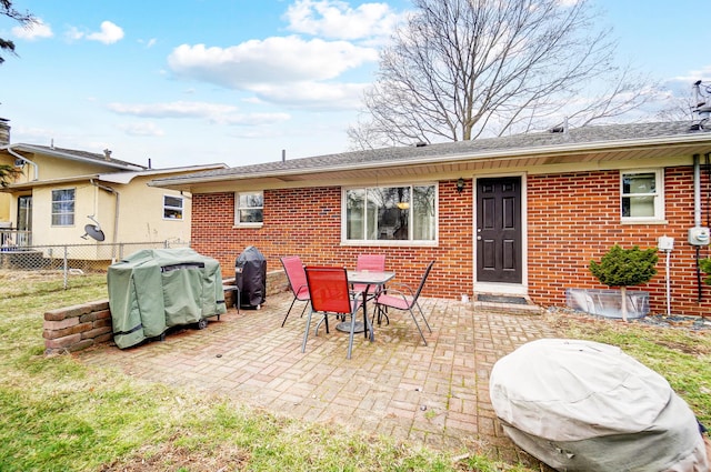 rear view of property featuring a patio area