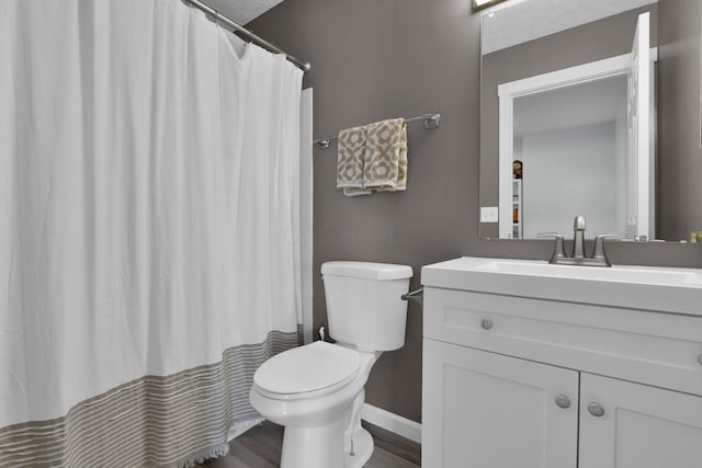 bathroom with wood-type flooring, vanity, toilet, and a shower with curtain