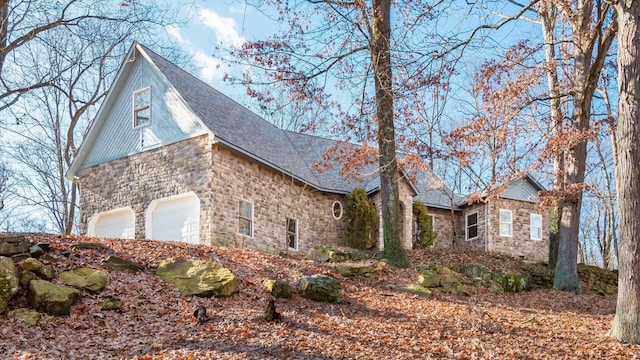 view of side of property featuring a garage