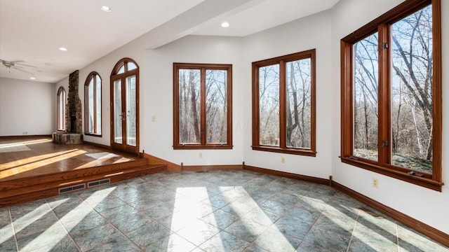 foyer featuring ceiling fan