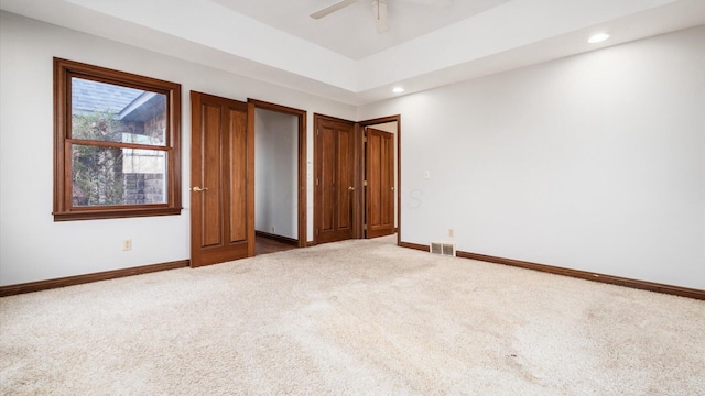 unfurnished bedroom featuring carpet flooring and ceiling fan