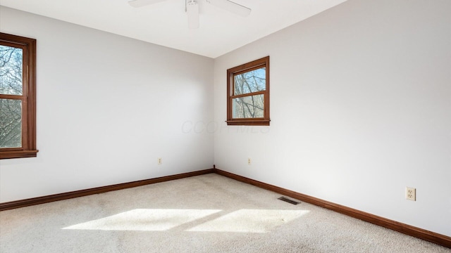 unfurnished room with carpet floors and ceiling fan