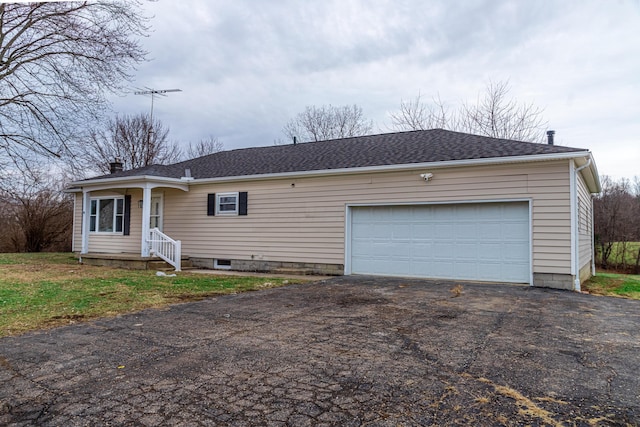 ranch-style house featuring a garage