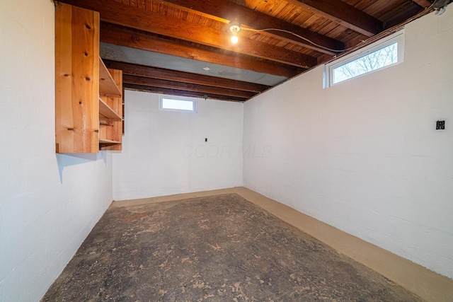 basement with plenty of natural light and wooden ceiling