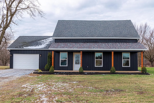 view of front facade with a garage and a front lawn