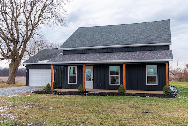 view of front of house featuring a front yard and a garage