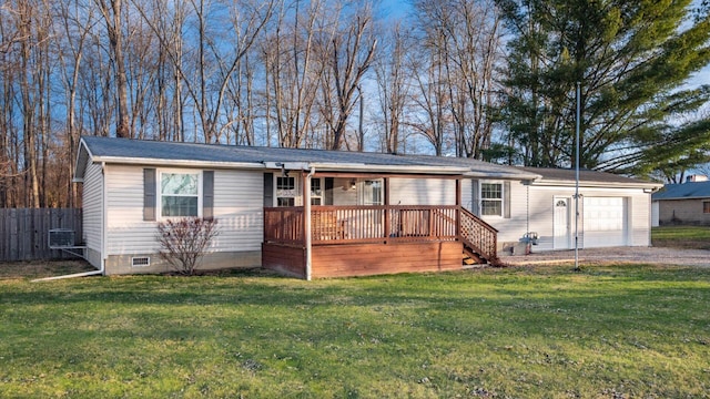 ranch-style house with a garage, central air condition unit, and a front yard