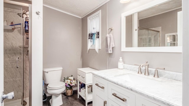 bathroom featuring a textured ceiling, toilet, a shower with door, vanity, and ornamental molding