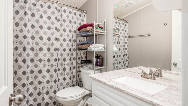 bathroom featuring vanity, a shower with shower curtain, and toilet