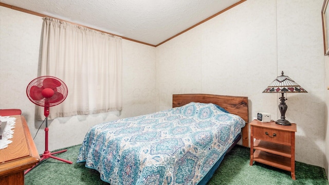 bedroom featuring crown molding, dark carpet, and a textured ceiling