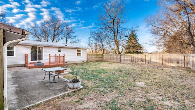 view of yard featuring a patio and a deck