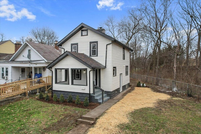 view of front facade with covered porch and a front lawn