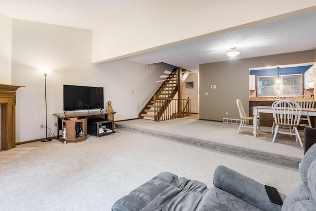 living room with carpet and a textured ceiling