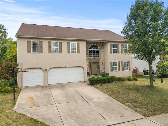 view of front of home with a garage and a front yard