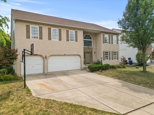 view of front facade featuring a front lawn and a garage