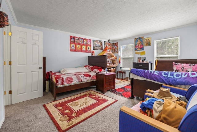 bedroom featuring a textured ceiling, carpet floors, and ornamental molding