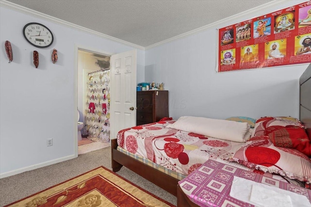 carpeted bedroom featuring ensuite bathroom, ornamental molding, and a textured ceiling