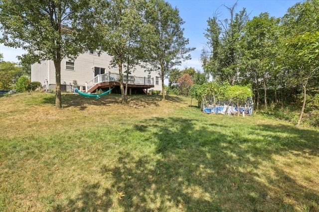 view of yard featuring a wooden deck