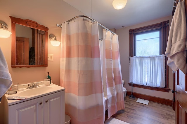 bathroom featuring vanity and hardwood / wood-style flooring