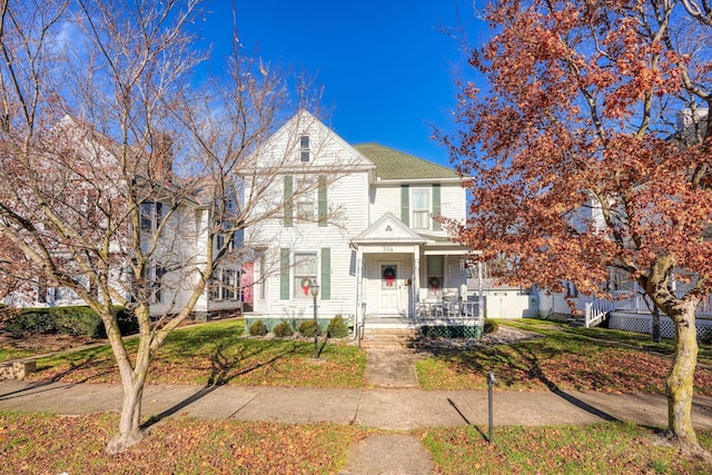 view of front of house featuring a front yard and covered porch