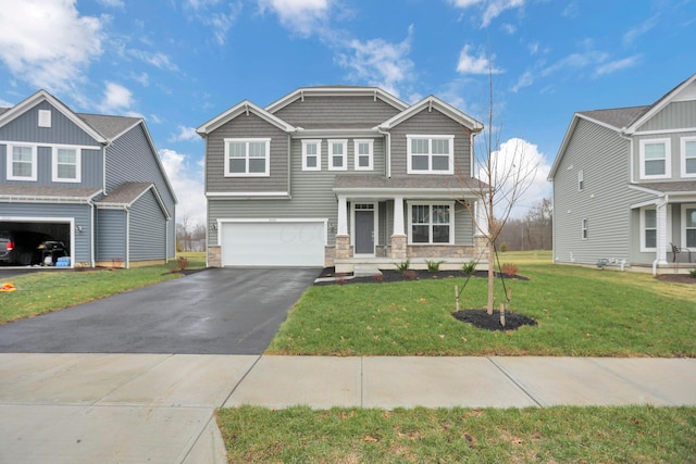 view of front of property featuring a front yard and a garage