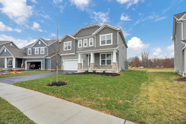 view of front of property featuring a garage and a front lawn