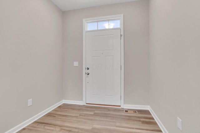 doorway to outside with light hardwood / wood-style floors