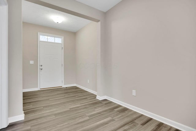 foyer with light hardwood / wood-style floors