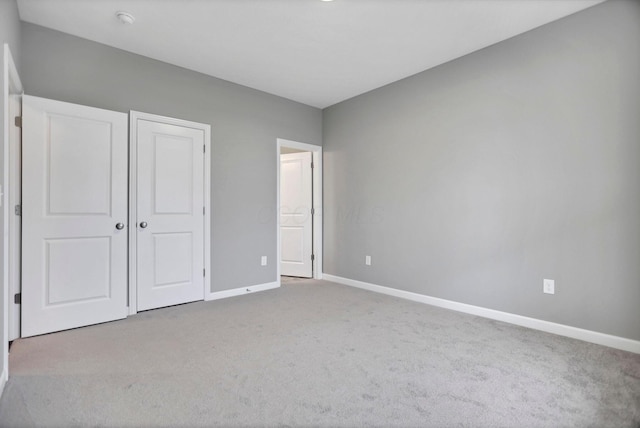 unfurnished bedroom featuring carpet flooring