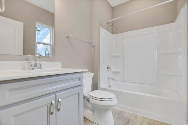 full bathroom with vanity, shower / bath combination, and toilet