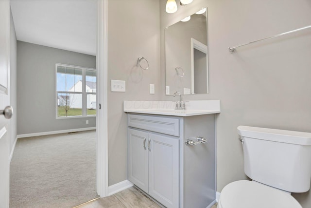 bathroom with vanity and toilet