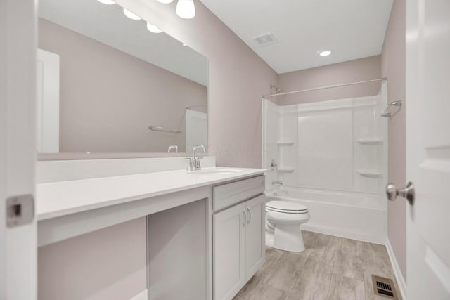 full bathroom featuring vanity,  shower combination, and toilet