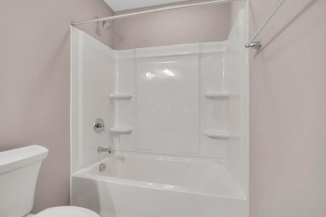 bathroom featuring toilet and shower / washtub combination