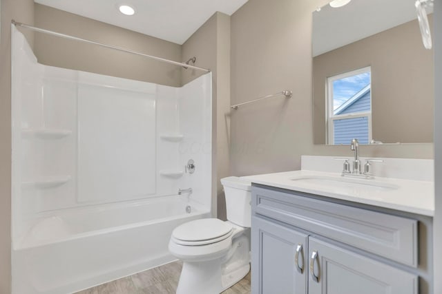 full bathroom with vanity, bathtub / shower combination, and toilet