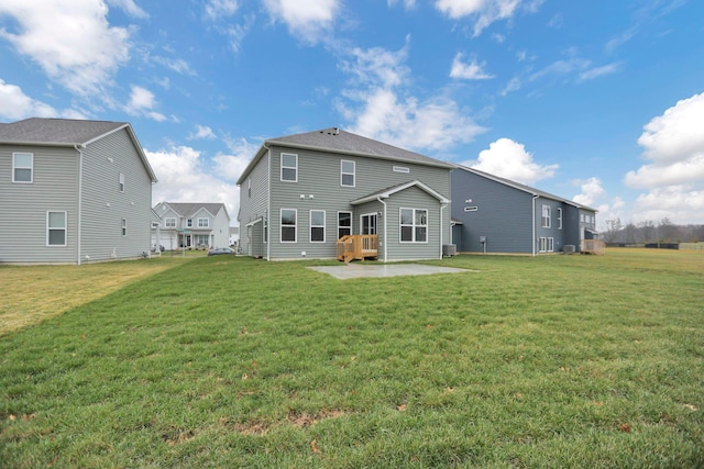 back of house with a yard and a patio area