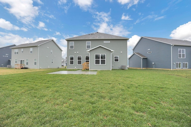 rear view of house with a patio area and a yard