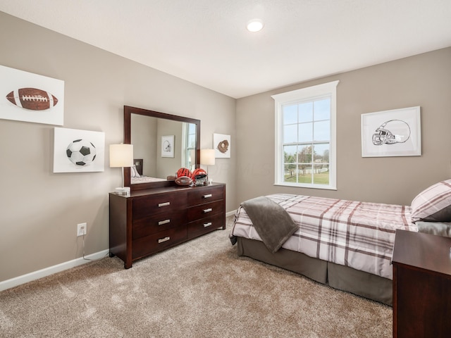 bedroom with light carpet