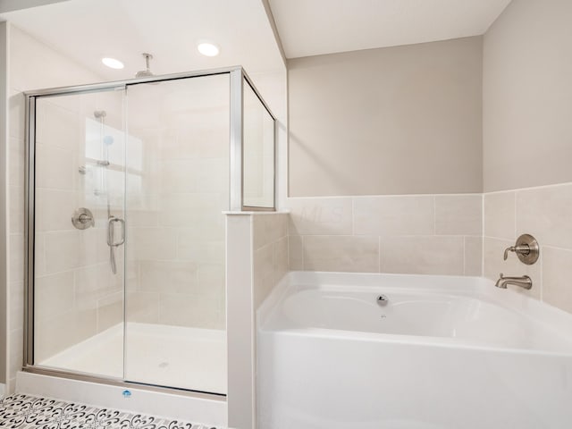 bathroom with tile patterned flooring and plus walk in shower