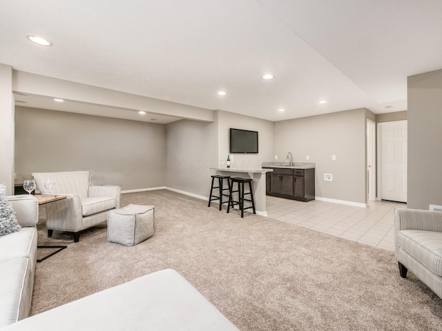 carpeted living room featuring sink